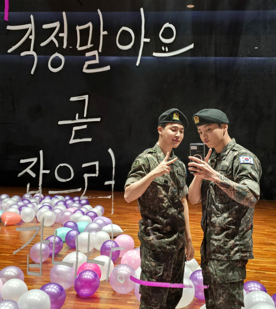 Jimin and Jungkook mirror selca in the practice room in their military uniforms on the day they were discharged.